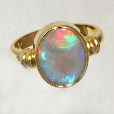 CUSTOM MADE 18k Yellow Gold Ring with a SOLID SEMI BLACK OPAL Large rolling flashes of bright red turning to peacock blue with a touch of green and purple